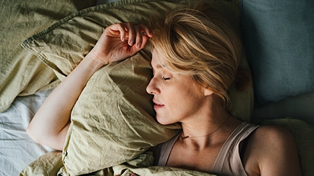 A person sleeping in bed.
