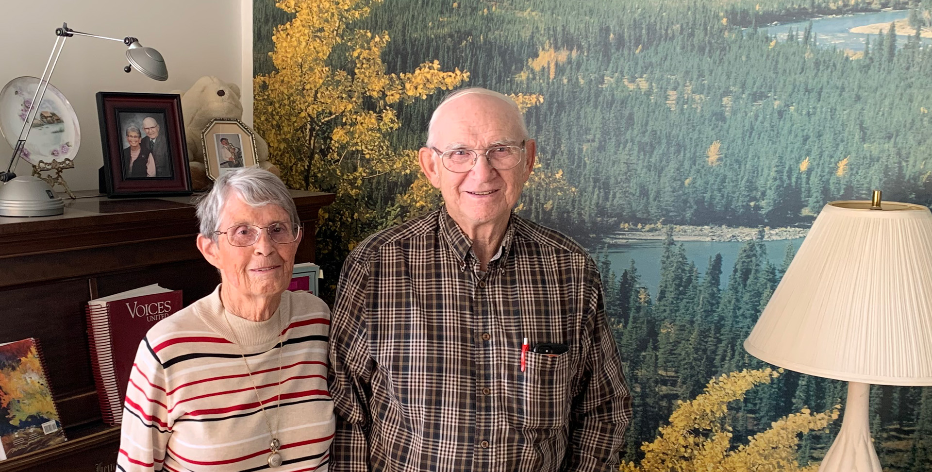 Carol and Barrie Clayton pose for a photo indoors. 
