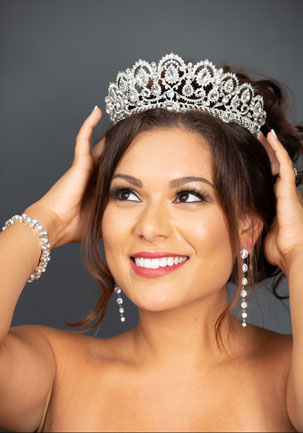 Samantha putting on a diamond crown